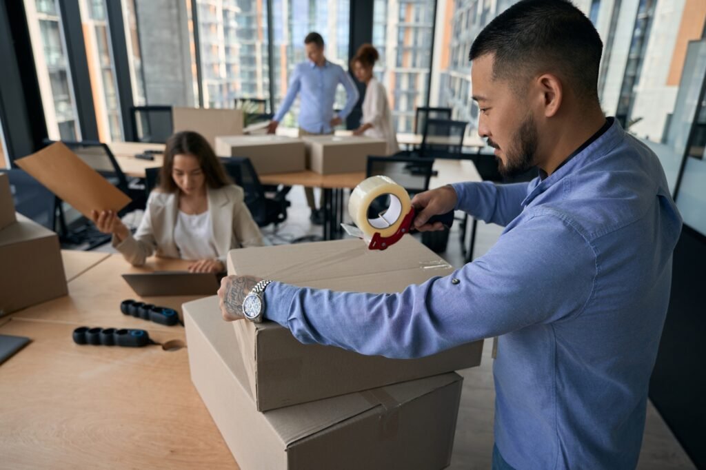 Group of corporate workers preparing for office relocation and Office removals