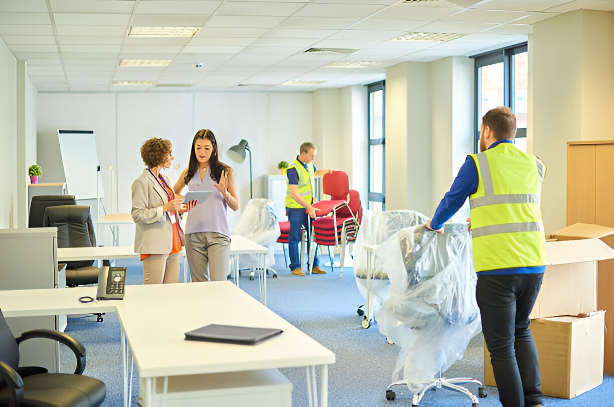 Office removals Group of corporate workers preparing for office relocation and Office removals